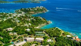 Upscale oceanfront homes beside sapphire blue waters, East End, St Thomas  Aerial Stock Photos | AX102_246.0000000F