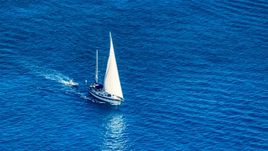 Sailboat in sapphire blue Caribbean waters, St Thomas, USVI  Aerial Stock Photos | AX102_256.0000138F