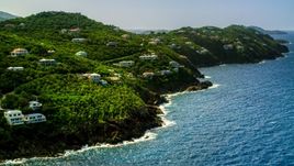 Hillside mansions on an island coast overlooking the ocean, Northside, St Thomas  Aerial Stock Photos | AX102_267.0000000F