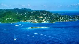 Coastal town on a hillside and blue Caribbean waters, Cruz Bay, St John Aerial Stock Photos | AX103_016.0000000F