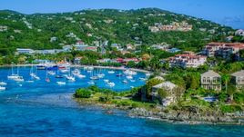 Turquoise blue Caribbean waters in the harbor with boats, Cruz Bay, St John Aerial Stock Photos | AX103_030.0000000F