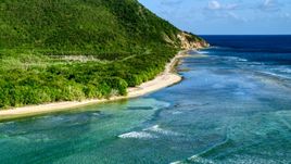 A Caribbean beach along jungle and sapphire blue Caribbean waters, Reef Bay, St John Aerial Stock Photos | AX103_046.0000037F