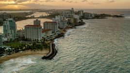 Beachfront Caribbean hotels along the ocean, San Juan, Puerto Rico, sunset Aerial Stock Photos | AX104_070.0000000F