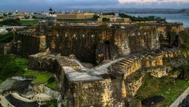A view of Fort San Felipe del Morro, Old San Juan, Puerto Rico, twilight Aerial Stock Photos | AX104_083.0000000F