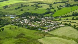 Rural homes surrounded by green fields, Banton, Scotland Aerial Stock Photos | AX109_003.0000117F