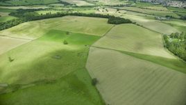 Green farm fields in Stirling, Scotland Aerial Stock Photos | AX109_011.0000094F