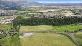 Stirling Castle, neighborhoods, and farmland, Scotland Aerial Stock Photos | AX109_018.0000000F