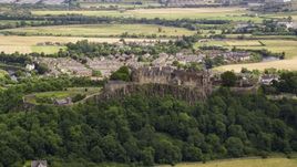 Hilltop Stirling Castle among trees, Scotland Aerial Stock Photos | AX109_019.0000000F