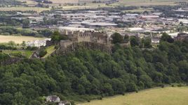 A view of historic Stirling Castle on a hill in Scotland Aerial Stock Photos | AX109_021.0000170F