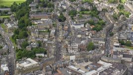 A view of city streets and apartment buildings in Stirling, Scotland Aerial Stock Photos | AX109_031.0000000F