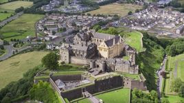 Historic Stirling Castle on a hill in Scotland Aerial Stock Photos | AX109_035.0000118F