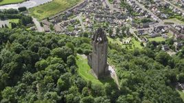 The historic Wallace Monument with a view of Stirling, Scotland Aerial Stock Photos | AX109_051.0000142F