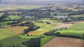 A farm and farmland in Blair Drummond, Scotland Aerial Stock Photos | AX109_063.0000000F