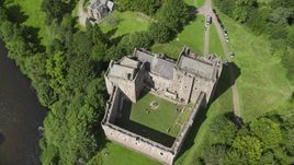 A bird's eye view of historic Doune Castle and its grounds, Scotland Aerial Stock Photos | AX109_072.0000120F