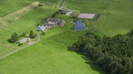 A sheep farm and pond, Stirling, Scotland Aerial Stock Photos | AX109_091.0000000F