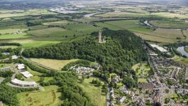 Historic Wallace Monument atop Abbey Craig hill, Stirling, Scotland Aerial Stock Photos | AX109_099.0000000F