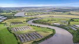 Riverfront warehouses by River Forth in Fallin, Scotland Aerial Stock Photos | AX109_103.0000130F