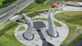 The back of the iconic Kelpies sculptures in Falkirk, Scotland Aerial Stock Photos | AX109_125.0000127F