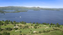 Waterfront Loch Lomond Golf Course in Luss, view of the lake, Scottish Highlands, Scotland Aerial Stock Photos | AX110_118.0000098F