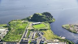 Dumbarton Castle and soccer stadium by the water, Scotland Aerial Stock Photos | AX110_140.0000000F