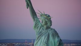 Profile of the Statue of Liberty at sunrise, New York Aerial Stock Photos | AX118_060.0000000F