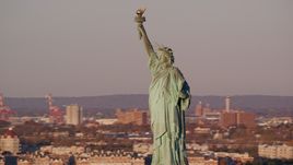 The front side of the Statue of Liberty at sunrise in New York Aerial Stock Photos | AX118_104.0000067F