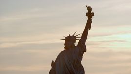 Back of the Statue of Liberty at sunrise in New York Aerial Stock Photos | AX118_111.0000000F