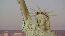 Close-up of the Statue of Liberty at sunrise in New York Aerial Stock Photos | AX118_116.0000128F