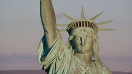 A close-up of the Statue of Liberty at sunrise in New York Aerial Stock Photos | AX118_116.0000231F