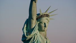 Close-up profile of the Statue of Liberty at sunrise in New York Aerial Stock Photos | AX118_117.0000113F