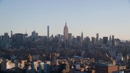 The Empire State Buildings and Midtown skyscrapers at sunrise in New York City Aerial Stock Photos | AX118_157.0000074F