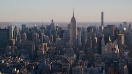 Empire State Building and Midtown skyscrapers at sunrise in New York City Aerial Stock Photos | AX118_168.0000173F
