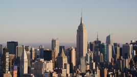 Empire State Building and Midtown high-rises at sunrise in New York City Aerial Stock Photos | AX118_176.0000000F