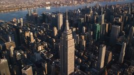 Empire State Building at sunrise in Midtown Manhattan, New York City Aerial Stock Photos | AX118_181.0000135F