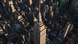 Empire State Building and spire at sunrise in Midtown Manhattan, New York City Aerial Stock Photos | AX118_182.0000195F