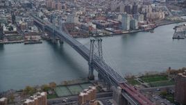 The Williamsburg Bridge spanning the East River in Autumn, New York City Aerial Stock Photos | AX120_153.0000347F