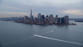 The Lower Manhattan skyline at sunset in Autumn, New York City, seen from New York Harbor Aerial Stock Photos | AX121_016.0000107F