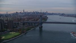 Lower East Side public housing, Williamsburg Bridge, and the Midtown skyline at sunset in New York City Aerial Stock Photos | AX121_044.0000169F