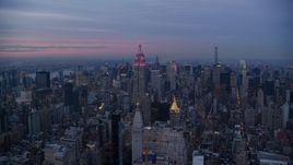 The Empire State Building and Midtown Manhattan skyscrapers at sunset in New York City Aerial Stock Photos | AX121_081.0000000F