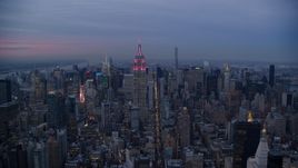 A view of the Empire State Building in Midtown at sunset in New York City Aerial Stock Photos | AX121_082.0000155F
