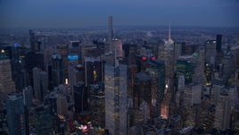 A group of tall Midtown skyscrapers at sunset in New York City Aerial Stock Photos | AX121_087.0000257F