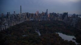 Midtown Manhattan skyscrapers and The Lake in Central Park at sunset, New York City Aerial Stock Photos | AX121_098.0000265F
