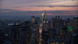 Chrysler Building in front of Midtown skyscrapers at sunset, New York City Aerial Stock Photos | AX121_116.0000185F