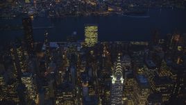 The United Nations and top of the Chrysler Building at night in New York City Aerial Stock Photos | AX121_138.0000000F