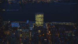 The United Nations by the East River at night in Midtown Manhattan, New York City Aerial Stock Photos | AX121_138.0000309F