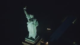 Statue of Liberty at nighttime in New York Aerial Stock Photos | AX121_168.0000211F