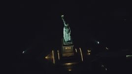 The side of the Statue of Liberty at night in New York Aerial Stock Photos | AX121_195.0000229F