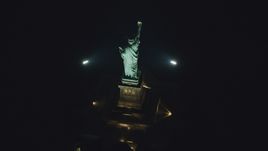 A bird's eye of the Statue of Liberty at nighttime in New York Aerial Stock Photos | AX121_196.0000217F