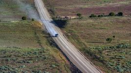 A silver SUV on Hatch Point Road in Moab, Utah Aerial Stock Photos | AX138_223.0000000