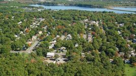 Small town neighborhoods and trees in autumn, Randolph, Massachusetts Aerial Stock Photos | AX143_004.0000035